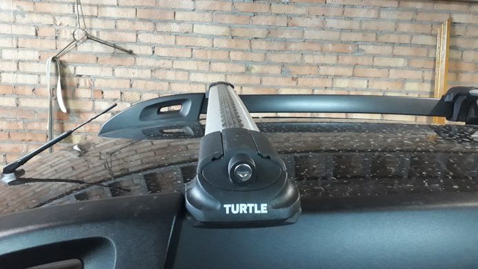 Багажник Turtle AIR1 Dacia Duster 2014-2017 на рейлінги (на широкий рейлінг), Хром, Аеродинамічна